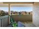 View from balcony featuring muted green railings and partial mountain views in the background at 3035 Oneal Pkwy # 35T, Boulder, CO 80301