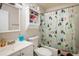 Functional bathroom featuring a vanity, toilet, and shower with decorative curtain at 3035 Oneal Pkwy # 35T, Boulder, CO 80301