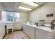 Clean laundry room with multiple white appliances and a window to the exterior at 3035 Oneal Pkwy # 35T, Boulder, CO 80301