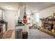 Cozy living room featuring a stone fireplace, wood mantel, and an open layout with kitchen at 3035 Oneal Pkwy # 35T, Boulder, CO 80301