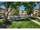 Community pool area with outdoor furniture, grilling area and a grassy spot to relax at 3035 Oneal Pkwy # 35T, Boulder, CO 80301