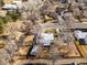 A clear view from above shows a neat home, set amidst bare trees in a well-tended neighborhood at 3145 S Ash St, Denver, CO 80222