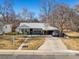 Charming single-story home with a covered front porch and attached carport at 3145 S Ash St, Denver, CO 80222