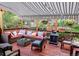 Cozy deck features comfortable seating, a retractable awning, and vibrant flower boxes for relaxing outdoor living at 32209 Blue Springs Dr, Evergreen, CO 80439