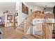 Grand foyer features a staircase with wood banister, hardwood floors, and elegant decor elements at 32209 Blue Springs Dr, Evergreen, CO 80439