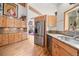 Gourmet kitchen showcasing custom cabinetry, stainless steel appliances, and beautiful granite countertops at 32209 Blue Springs Dr, Evergreen, CO 80439