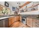 Well-appointed kitchen with granite countertops, stainless steel appliances, and ample cabinet space at 32209 Blue Springs Dr, Evergreen, CO 80439