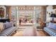 Cozy living room with French doors that open to a patio and scenic outdoor space at 32209 Blue Springs Dr, Evergreen, CO 80439