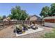 Backyard patio features comfortable outdoor seating and lush garden views at 12143 Dahlia Dr, Thornton, CO 80241