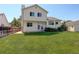 Spacious backyard with green lawn, privacy fence, patio access from the house and storage shed at 12143 Dahlia Dr, Thornton, CO 80241