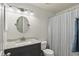 Bathroom features a sink, vanity, and toilet with shower-tub combo at 12143 Dahlia Dr, Thornton, CO 80241