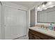 Bathroom with a light wood vanity with marble countertop and white sink basin at 12143 Dahlia Dr, Thornton, CO 80241