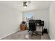 Bedroom features a ceiling fan, large window and neutral-colored carpet at 12143 Dahlia Dr, Thornton, CO 80241