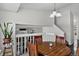 Cozy dining area with wood table, white walls, and decorative light fixture at 12143 Dahlia Dr, Thornton, CO 80241