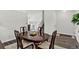 Traditional dining room features an oval table, classic chairs, and wood-look flooring at 12143 Dahlia Dr, Thornton, CO 80241