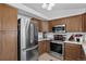 Modern kitchen with stainless steel appliances, plenty of cabinet storage, and an open layout at 12143 Dahlia Dr, Thornton, CO 80241