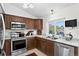 Well-equipped kitchen with stainless steel appliances, ample counter space, and natural lighting at 12143 Dahlia Dr, Thornton, CO 80241