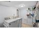 Laundry room with a new washer and dryer and a shelving unit at 12143 Dahlia Dr, Thornton, CO 80241
