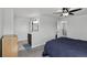 Spacious main bedroom featuring a ceiling fan, ensuite bathroom, and ample closet space at 12143 Dahlia Dr, Thornton, CO 80241