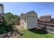Exterior view of a storage shed with well-maintained garden in backyard at 12143 Dahlia Dr, Thornton, CO 80241