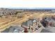 Aerial view of a residential neighborhood with walking paths, green spaces, and convenient access to local amenities at 8944 Fox Dr, Denver, CO 80260
