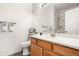 Modern bathroom with a sleek vanity, stylish fixtures, and a glass-enclosed shower at 8944 Fox Dr, Denver, CO 80260