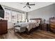 Comfortable bedroom featuring hardwood floors, natural light, and classic furnishings at 8944 Fox Dr, Denver, CO 80260