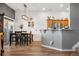 Dining area with hardwood floors adjacent to a kitchen with stainless appliances at 8944 Fox Dr, Denver, CO 80260