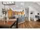 Open kitchen featuring a breakfast bar, stainless steel appliances and wood cabinets at 8944 Fox Dr, Denver, CO 80260
