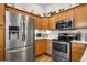 Charming kitchen with stainless steel appliances and lots of cabinet space at 8944 Fox Dr, Denver, CO 80260
