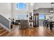 Bright living room with vaulted ceilings, large windows, and hardwood flooring at 8944 Fox Dr, Denver, CO 80260
