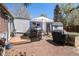 Cozy backyard with brick patio, outdoor dining area and grill; perfect for entertaining al fresco at 3768 S Acoma St, Englewood, CO 80110