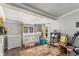 Well-lit Bedroom with a crib, dresser, and a comfortable chair at 3768 S Acoma St, Englewood, CO 80110