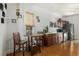 Cozy dining area featuring wood flooring, neutral walls, and ample natural light at 3768 S Acoma St, Englewood, CO 80110