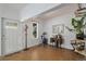 Open entryway with space for recreation and decor provides a welcoming and flexible living area at 3768 S Acoma St, Englewood, CO 80110