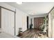 Bright hallway featuring hardwood flooring and neutral colors at 3768 S Acoma St, Englewood, CO 80110