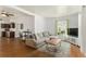 Spacious living room with wood flooring, and open layout flows seamlessly into the kitchen at 3768 S Acoma St, Englewood, CO 80110