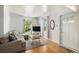 Bright living room featuring wood floors, natural light, and comfortable seating perfect for relaxing at 3768 S Acoma St, Englewood, CO 80110