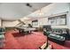 Finished basement with a pool table, exercise equipment, and a comfortable lounge area at 6922 W Walden Pl, Littleton, CO 80128
