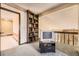 This bonus room features an alcove with bookshelf, as well as views of the Gathering room at 6922 W Walden Pl, Littleton, CO 80128