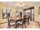 Elegant dining room boasts a chandelier, spacious layout, and easy access to other living areas at 6922 W Walden Pl, Littleton, CO 80128