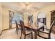 Formal dining room featuring a chandelier, large window, and ample seating for Gathering gatherings at 6922 W Walden Pl, Littleton, CO 80128