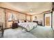 Tranquil main bedroom with floral wallpaper and plush carpeting at 6922 W Walden Pl, Littleton, CO 80128