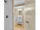 Bright bathroom features modern white vanity with shower and updated fixtures at 12664 W Virginia Ave, Lakewood, CO 80228