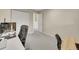 Bedroom featuring carpet floors, desk and adjacent closet space at 12664 W Virginia Ave, Lakewood, CO 80228