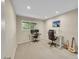 Well-lit bedroom featuring two work stations and a view through the window at 12664 W Virginia Ave, Lakewood, CO 80228
