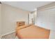 Carpeted bedroom with a bed and a closet with a view of the home's interior at 12664 W Virginia Ave, Lakewood, CO 80228