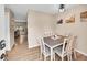 Cozy dining room with wood floors and stylish decor, adjacent to open living area at 12664 W Virginia Ave, Lakewood, CO 80228