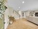 Spacious living room with hardwood floors, staircase, and ample natural light at 12664 W Virginia Ave, Lakewood, CO 80228