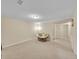 Finished basement area featuring neutral walls and carpet and a papasan chair at 12664 W Virginia Ave, Lakewood, CO 80228